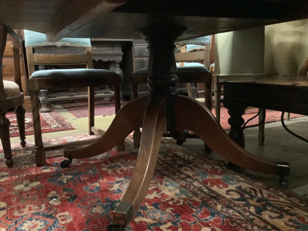 A Regency oak and ebony line inlaid octagonal topped breakfast table, width 138cm, height 72cm